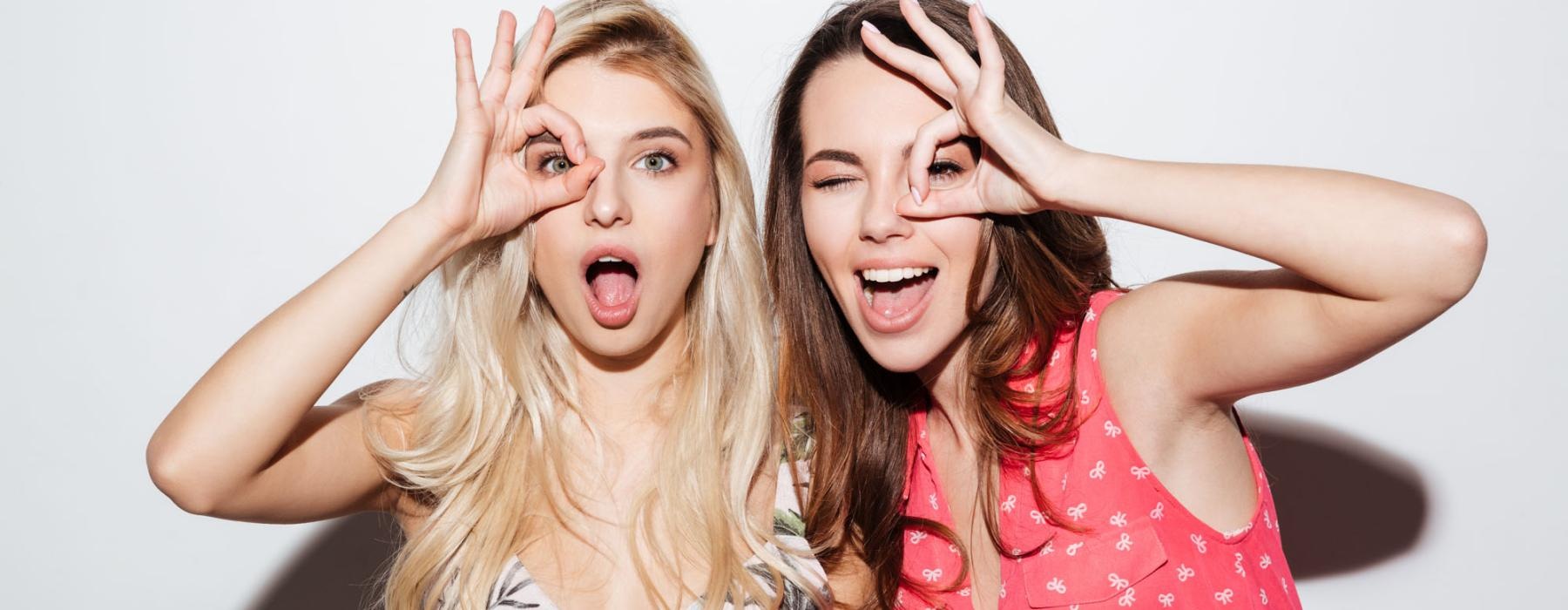 a couple of women posing for the camera