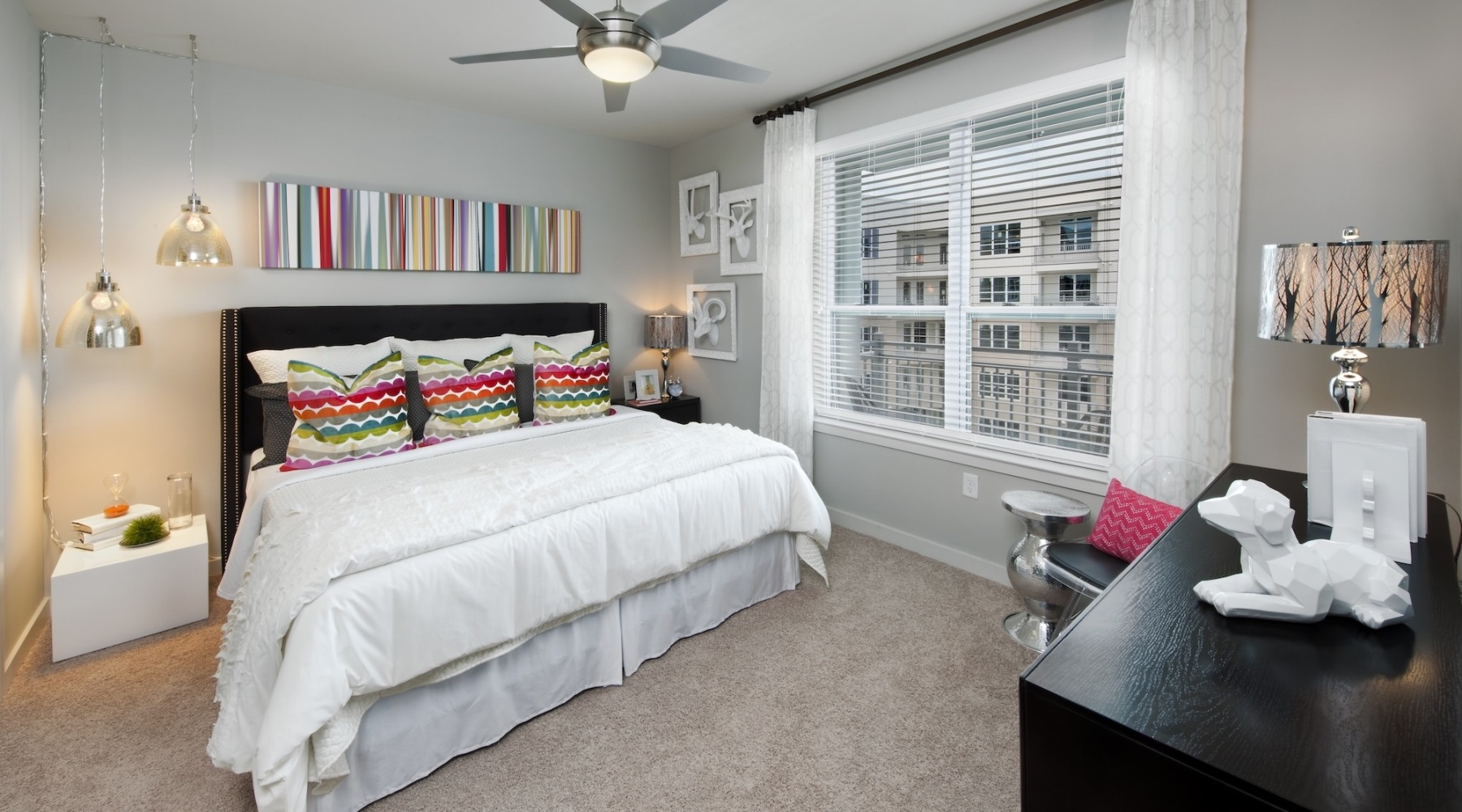 a bedroom with a bed and a desk