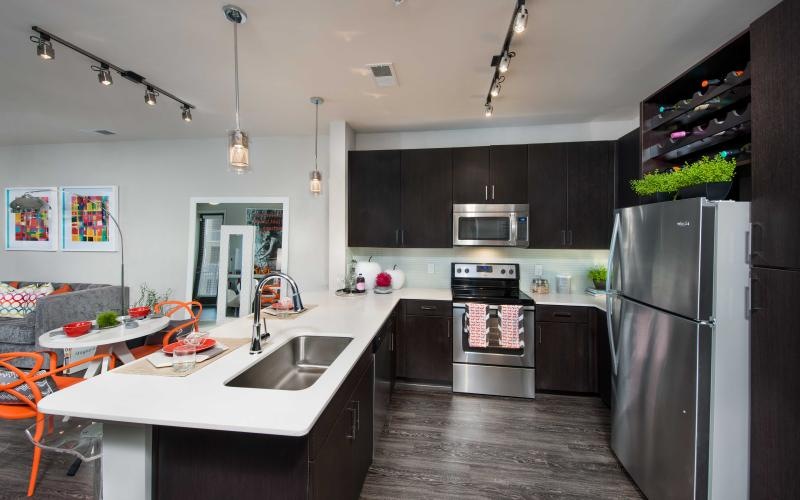 a kitchen with a table and chairs
